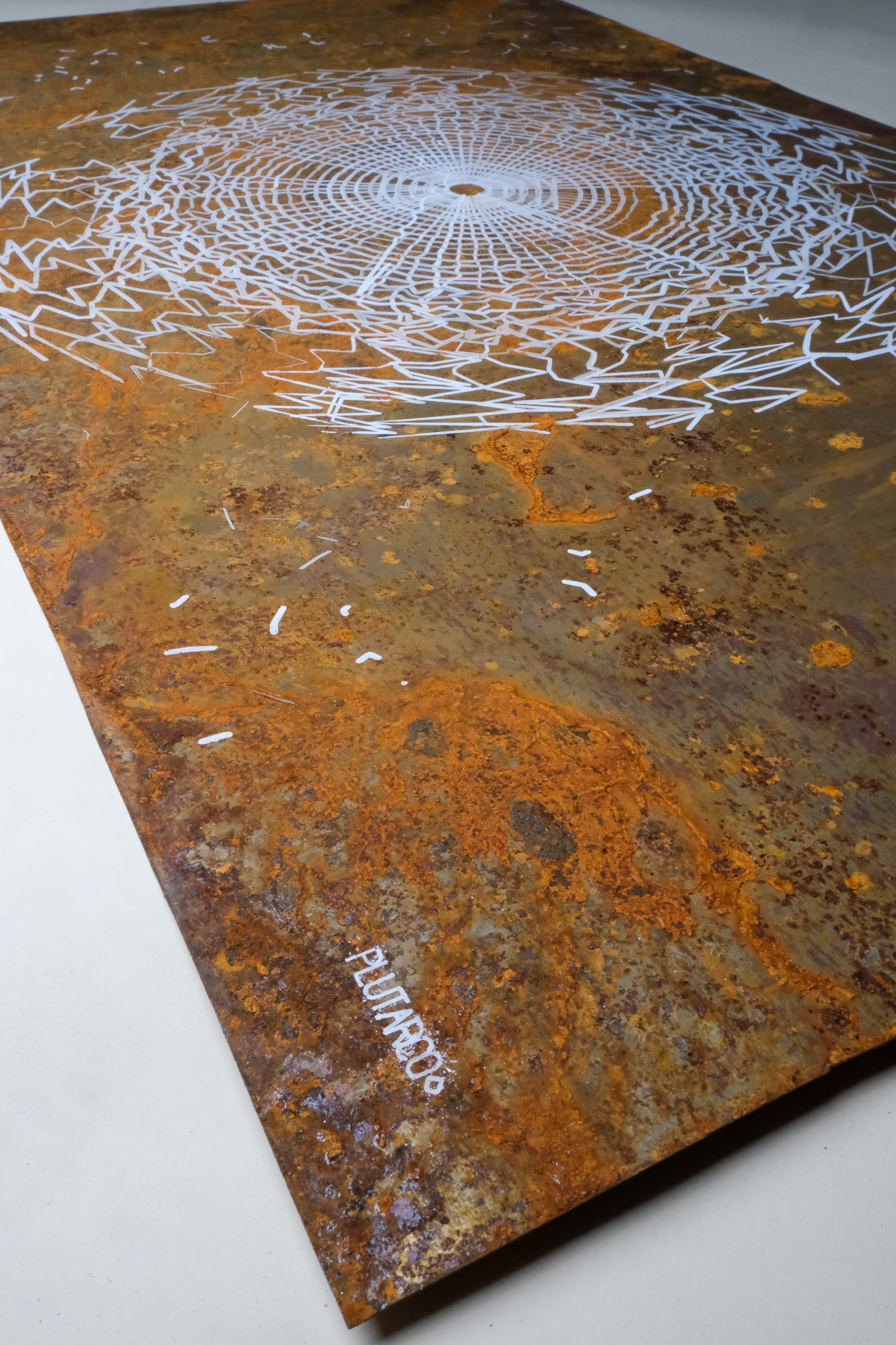 Pen plotter drawing on rusted steel